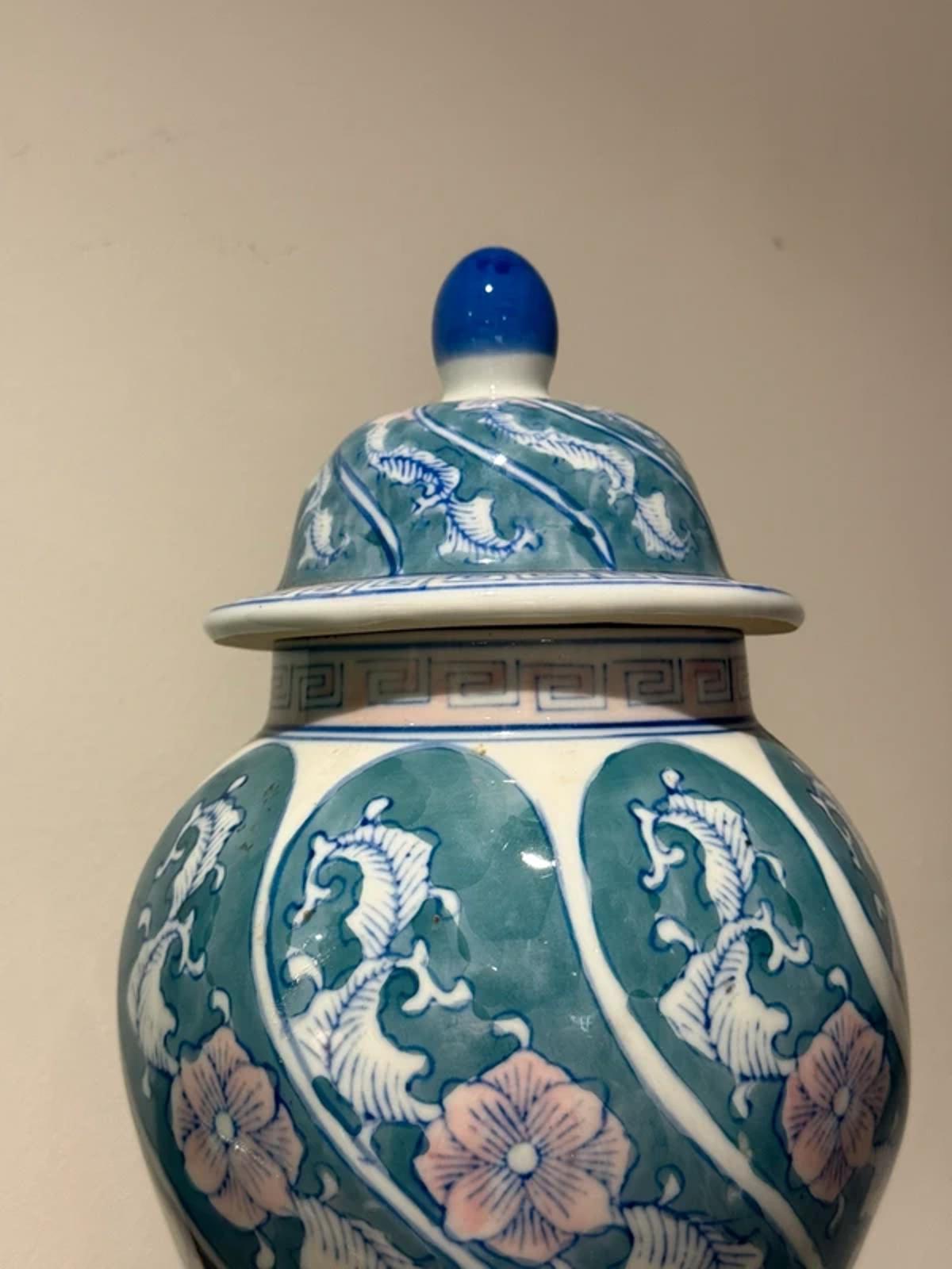 vintage Chinese porcelain ginger jar hand-painted floral motifs in blue, green, and pink colors